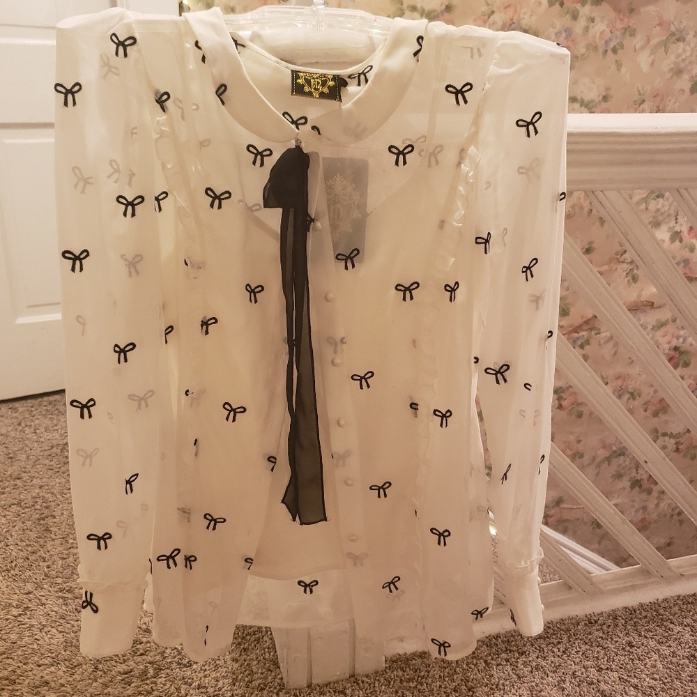 Nishe off-white blouse w/ Bows & Navy Blue tie.